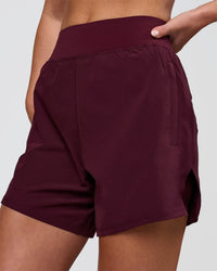 Woman wearing Challenger 5" Lined Performance Short - Cherry Lacquer | Model:Issy | Size:XS | Thumbnail Index: 0