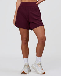 Woman wearing Challenger 5" Lined Performance Short - Cherry Lacquer | Model:Issy | Size:XS | Thumbnail Index: 1