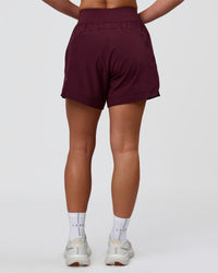 Woman wearing Challenger 5" Lined Performance Short - Cherry Lacquer | Model:Issy | Size:XS | Thumbnail Index: 3