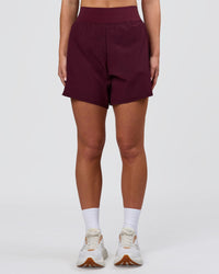 Woman wearing Challenger 5" Lined Performance Short - Cherry Lacquer | Model:Issy | Size:XS | Thumbnail Index: 5