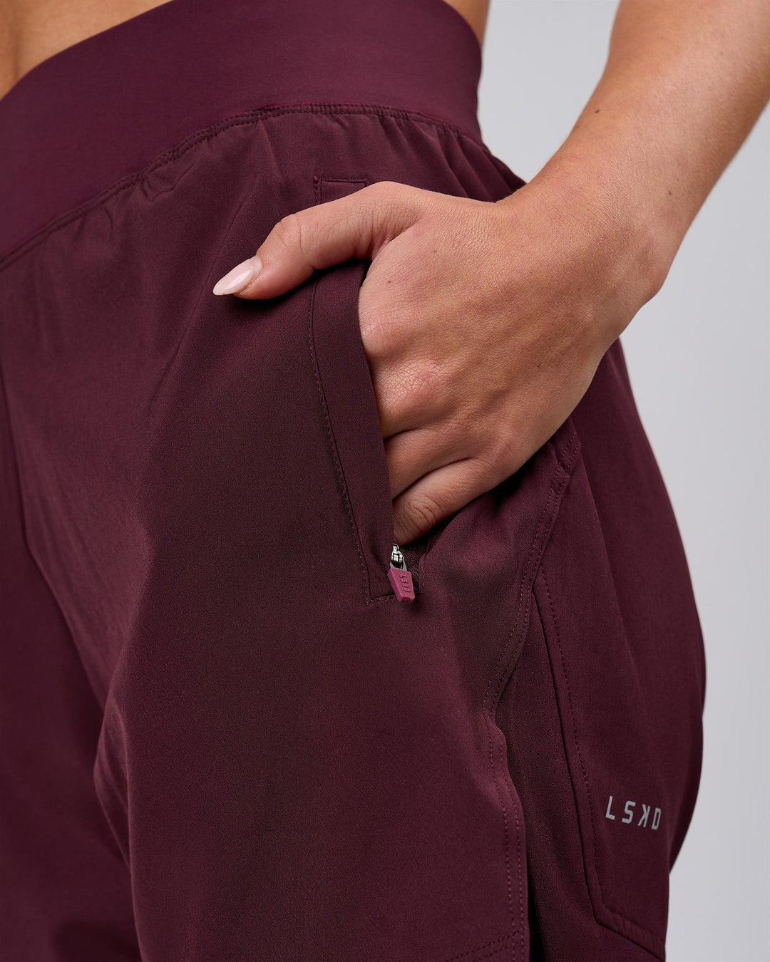 Woman wearing Challenger 5" Lined Performance Short - Cherry Lacquer | Model:Issy | Size:XS - view 7