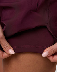 Woman wearing Challenger 5" Lined Performance Short - Cherry Lacquer | Model:Issy | Size:XS | Thumbnail Index: 7
