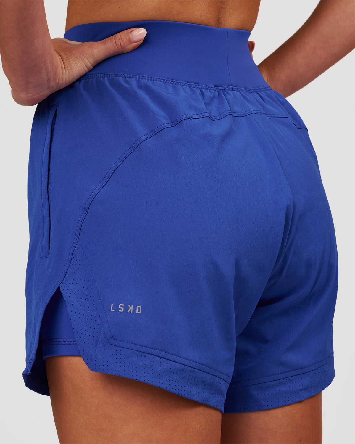 Woman wearing Challenger 5" Lined Performance Short - Power Cobalt | Model:Issy | Size:XS