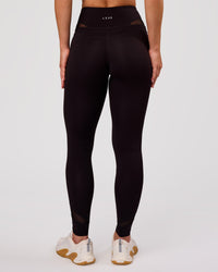 Woman wearing Dare High-Rise Full Length Legging - Black | Model:Issy | Size:XS | Thumbnail Index: 6