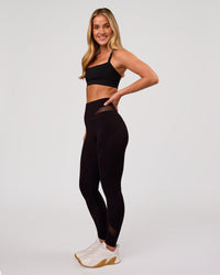 Woman wearing Dare High-Rise Full Length Legging - Black | Model:Issy | Size:XS | Thumbnail Index: 9