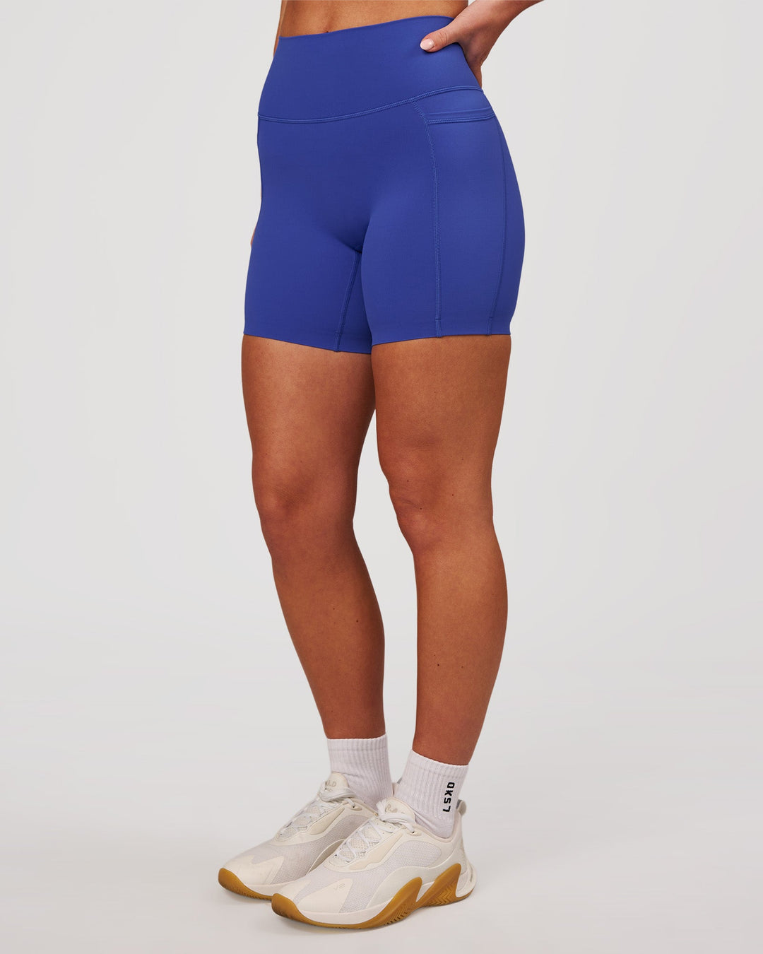 Woman wearing Elixir High-Rise 6" Short Pockets - Power Cobalt | Model:Issy | Size:XS - view 6