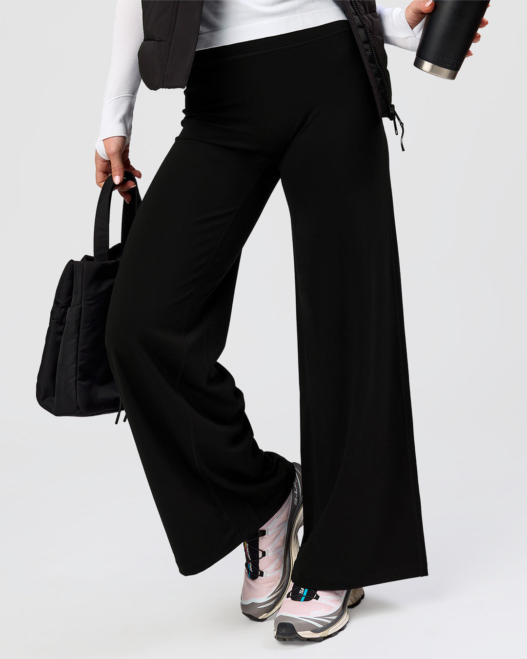 Woman wearing Elixir High-Rise Petite Pant - Black | Model:Issy | Size:XS - view 10