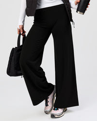 Woman wearing Elixir High-Rise Petite Pant - Black | Model:Issy | Size:XS | Thumbnail Index: 9