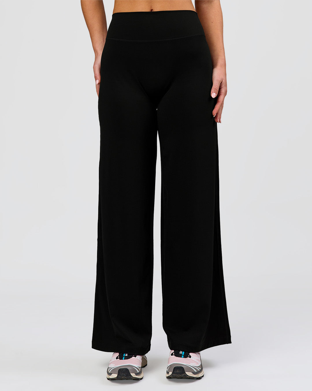 Woman wearing Elixir High-Rise Petite Pant - Black | Model:Issy | Size:XS