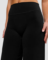 Woman wearing Elixir High-Rise Petite Pant - Black | Model:Issy | Size:XS | Thumbnail Index: 2