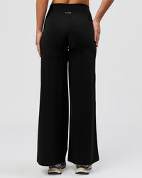 Woman wearing Elixir High-Rise Petite Pant - Black | Model:Issy | Size:XS | Thumbnail Index: 5