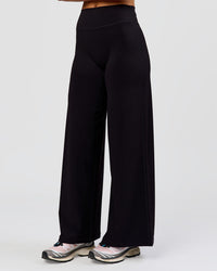 Woman wearing Elixir High-Rise Petite Pant - Black | Model:Issy | Size:XS | Thumbnail Index: 12
