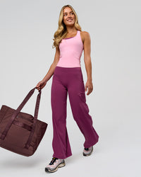 Woman wearing Elixir High-Rise Petite Pant - Boysenberry | Model:Issy | Size:XS | Thumbnail Index: 5