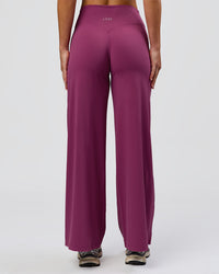Woman wearing Elixir High-Rise Petite Pant - Boysenberry | Model:Issy | Size:XS | Thumbnail Index: 6