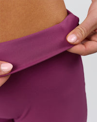 Woman wearing Elixir High-Rise Petite Pant - Boysenberry | Model:Issy | Size:XS | Thumbnail Index: 10