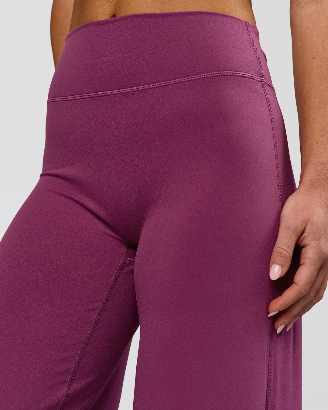 Woman wearing Elixir High-Rise Petite Pant - Boysenberry | Model:Issy | Size:XS - view 15