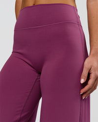 Woman wearing Elixir High-Rise Petite Pant - Boysenberry | Model:Issy | Size:XS | Thumbnail Index: 14