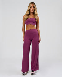 Woman wearing Elixir High-Rise Petite Pant - Boysenberry | Model:Issy | Size:XS | Thumbnail Index: 3