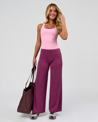 Woman wearing Elixir High-Rise Petite Pant - Boysenberry | Model:Issy | Size:XS | Thumbnail Index: 1