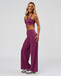 Woman wearing Elixir High-Rise Petite Pant - Boysenberry | Model:Issy | Size:XS | Thumbnail Index: 16
