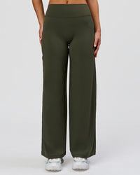 Woman wearing Elixir High-Rise Petite Pant - Pure Olive | Model:Issy | Size:XS | Thumbnail Index: 4