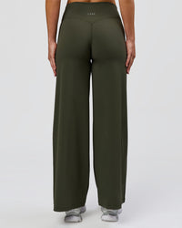 Woman wearing Elixir High-Rise Petite Pant - Pure Olive | Model:Issy | Size:XS | Thumbnail Index: 8