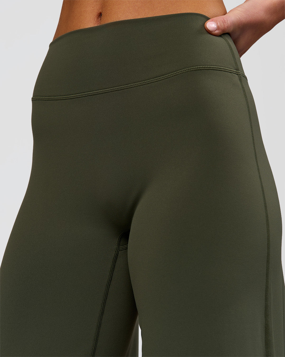 Woman wearing Elixir High-Rise Petite Pant - Pure Olive | Model:Issy | Size:XS - view 11