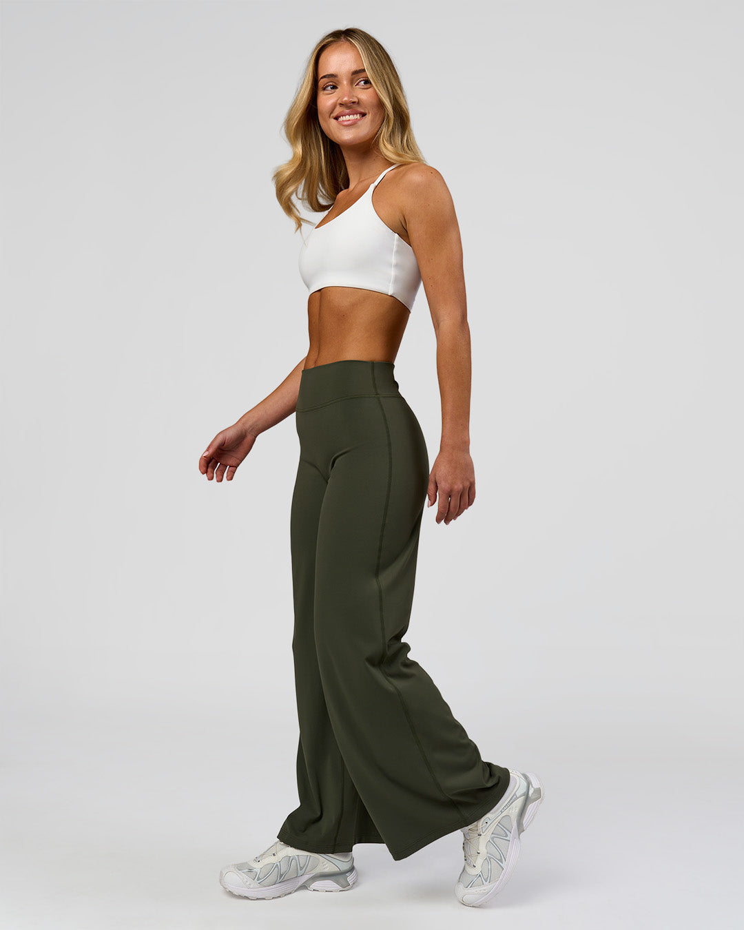 Woman wearing Elixir High-Rise Petite Pant - Pure Olive | Model:Issy | Size:XS - view 7