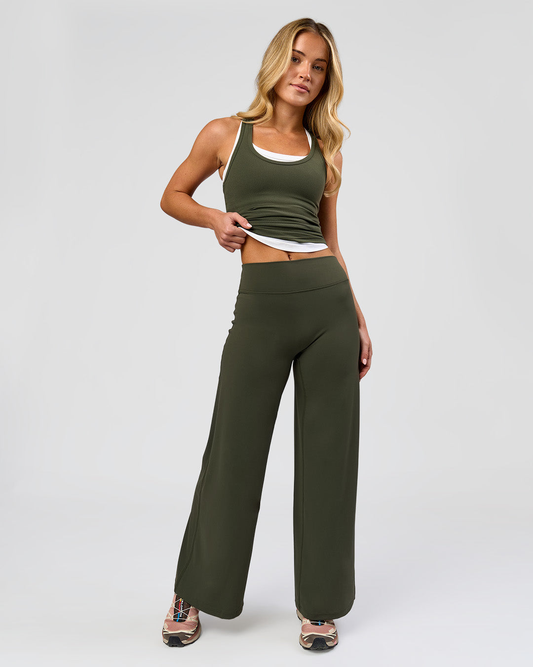 Woman wearing Elixir High-Rise Petite Pant - Pure Olive | Model:Issy | Size:XS - view 1