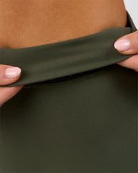 Woman wearing Elixir High-Rise Petite Pant - Pure Olive | Model:Issy | Size:XS | Thumbnail Index: 12