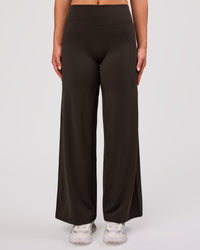 Woman wearing Elixir High-Rise Petite Pant - Ground Coffee | Model:Issy | Size:XS | Thumbnail Index: 0