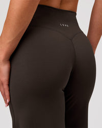 Woman wearing Elixir High-Rise Petite Pant - Ground Coffee | Model:Issy | Size:XS | Thumbnail Index: 8