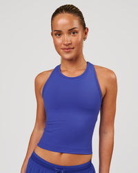 Woman wearing Flow Performance Tank 2.0 - Power Cobalt | Model:Issy | Size:XS | Thumbnail Index: 0