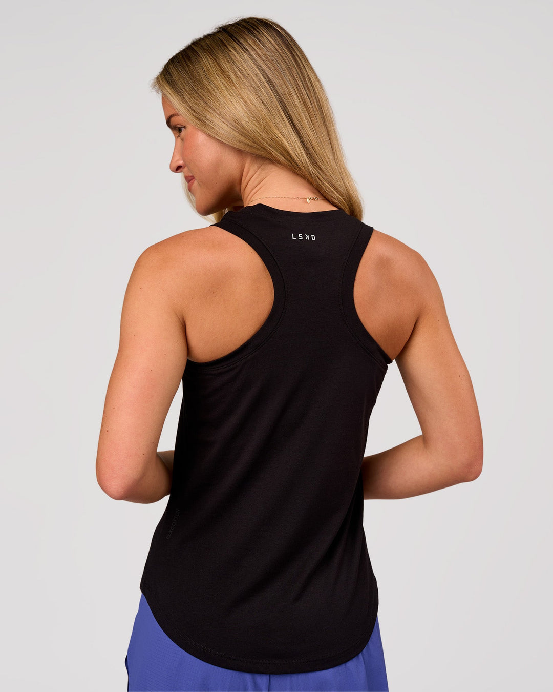 Woman wearing Force FLXCotton Longline Tank - Black | Model:Issy | Size:XS - view 3