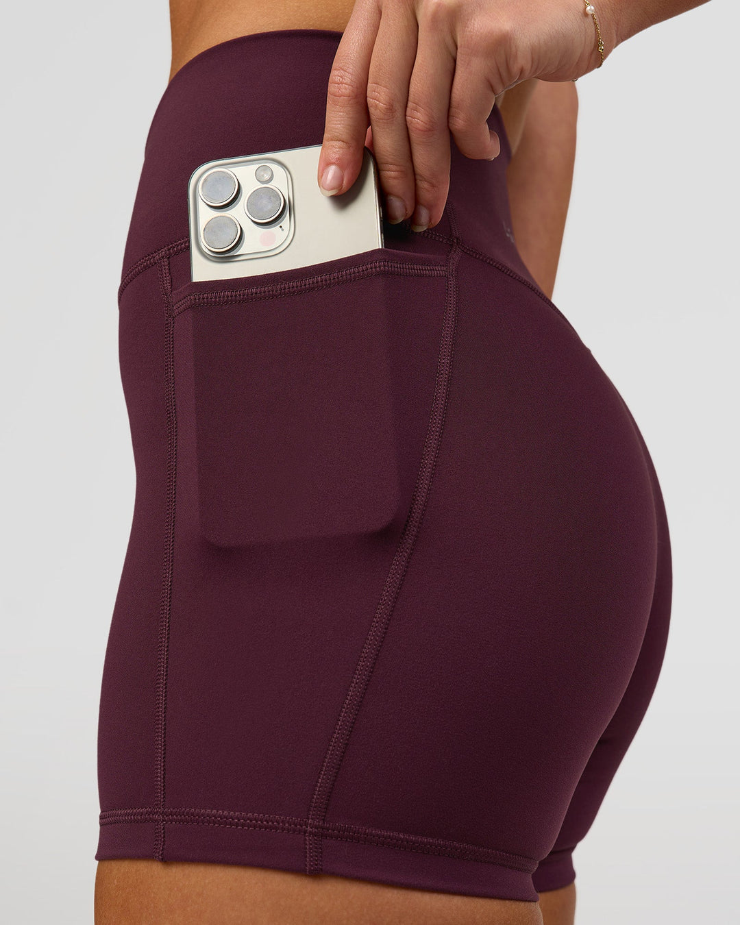 Woman wearing Fusion High-Rise 4" Short Pockets - Cherry Lacquer | Model:Issy | Size:XS - view 4