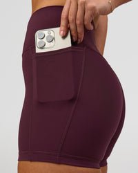 Woman wearing Fusion High-Rise 4" Short Pockets - Cherry Lacquer | Model:Issy | Size:XS | Thumbnail Index: 3