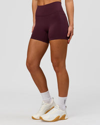 Woman wearing Fusion High-Rise 4" Short Pockets - Cherry Lacquer | Model:Issy | Size:XS | Thumbnail Index: 6