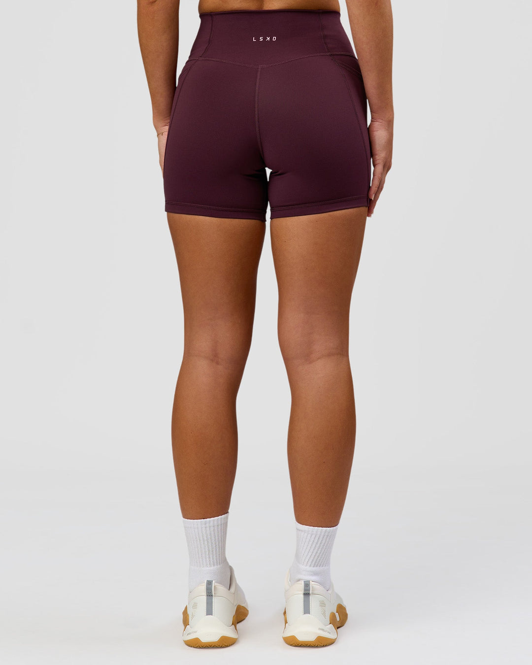 Woman wearing Fusion High-Rise 4" Short Pockets - Cherry Lacquer | Model:Issy | Size:XS - view 8