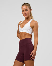Woman wearing Fusion High-Rise 6" Short Pockets - Cherry Lacquer | Model:Issy | Size:XS | Thumbnail Index: 0