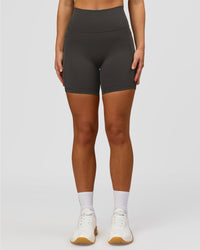 Woman wearing Fusion Ultra High-Rise 6" Short Pockets - Onyx | Model:Issy | Size:XS | Thumbnail Index: 6