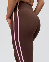 Woman wearing Fusion V-Contour Bind High-Rise Flared Legging - Hot Chocolate-Pink Rose | Model:Issy | Size:XS | Thumbnail Index: 8