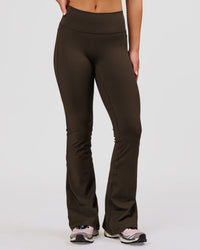 Woman wearing Fusion V-Contour High-Rise Flared Petite Legging Pockets - Ground Coffee | Model:Issy | Size:XS | Thumbnail Index: 2