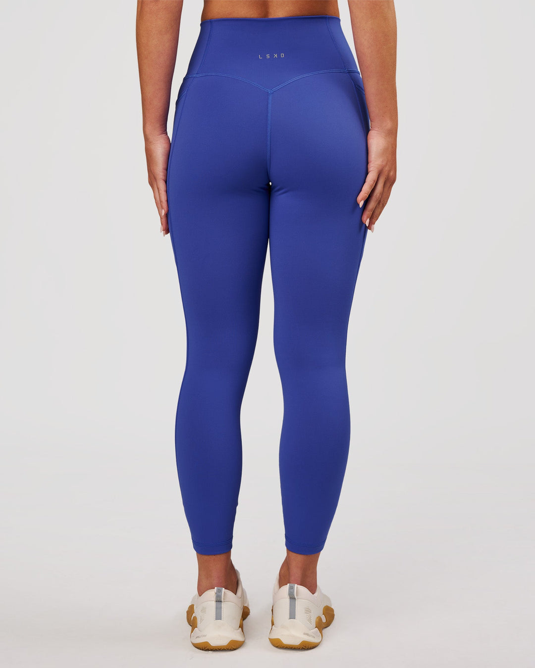 Woman wearing Fusion V-Contour Ultra High-Rise 7/8 Legging Pockets - Power Cobalt | Model:Issy | Size:XS - view 8