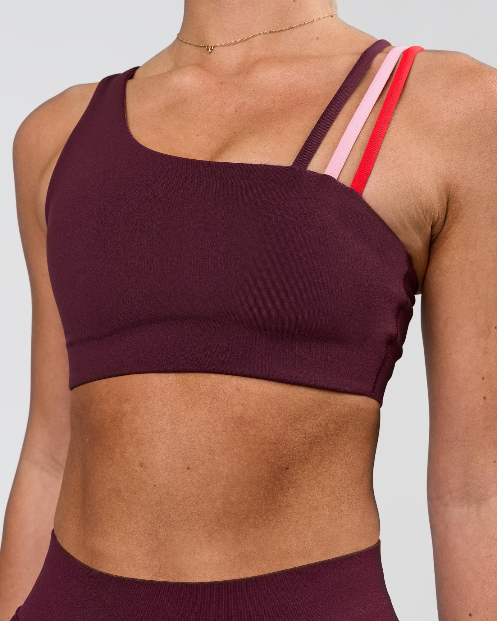Woman wearing Galvanise Sports Bra 2.0 - Cherry Lacquer-Multi | Model:Issy | Size:XS