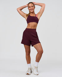 Woman wearing Galvanise Sports Bra 2.0 - Cherry Lacquer-Multi | Model:Issy | Size:XS | Thumbnail Index: 4
