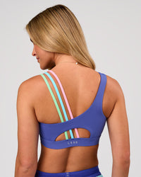 Woman wearing Galvanise Sports Bra 2.0 - Power Cobalt-Prism | Model:Issy | Size:XS | Thumbnail Index: 4
