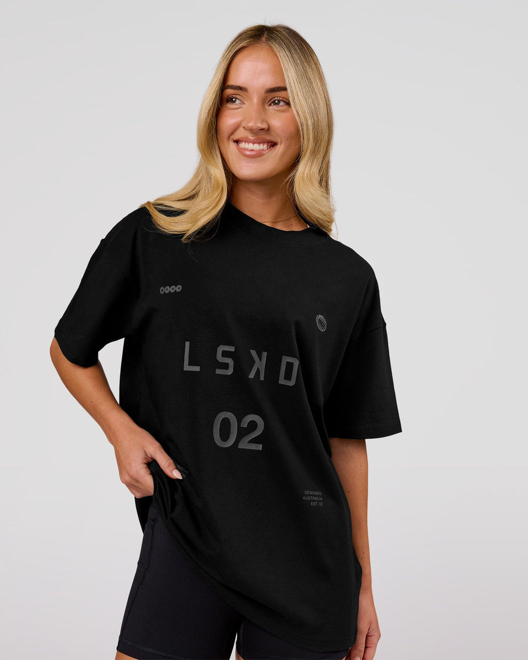 Woman wearing Game Plan Heavyweight FLXCotton Oversized Tee - Black | Model:Issy | Size:XS - view 3