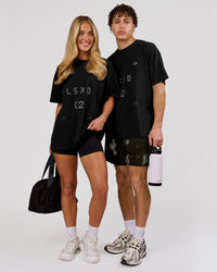 Woman wearing Game Plan Heavyweight FLXCotton Oversized Tee - Black | Model:Issy | Size:XS | Thumbnail Index: 6