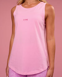 Woman wearing Go-To FLXCotton Longline Tank - Pink Rose-Ultra Pink | Model:Issy | Size:XS | Thumbnail Index: 1