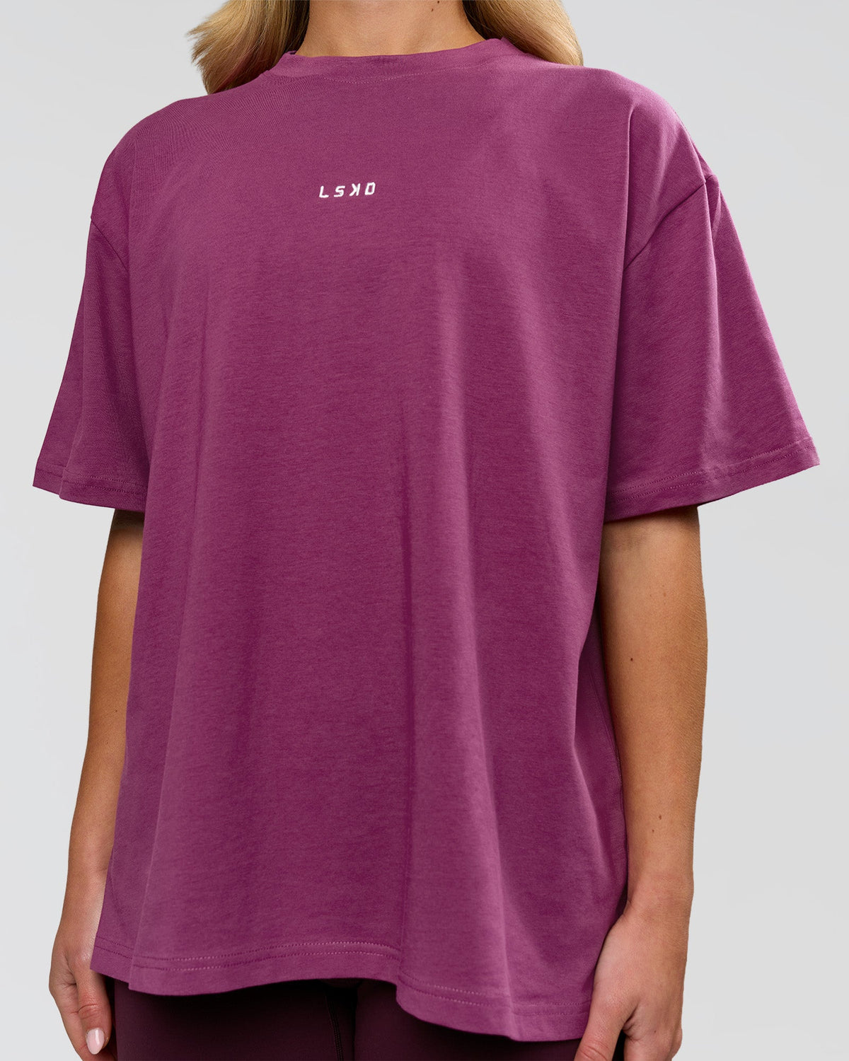 Woman wearing Go-To FLXCotton Oversized Tee - Boysenberry-White | Model:Issy | Size:XS